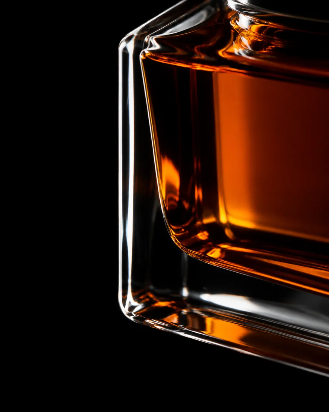 Amber fragrance inside heavy glass, macro